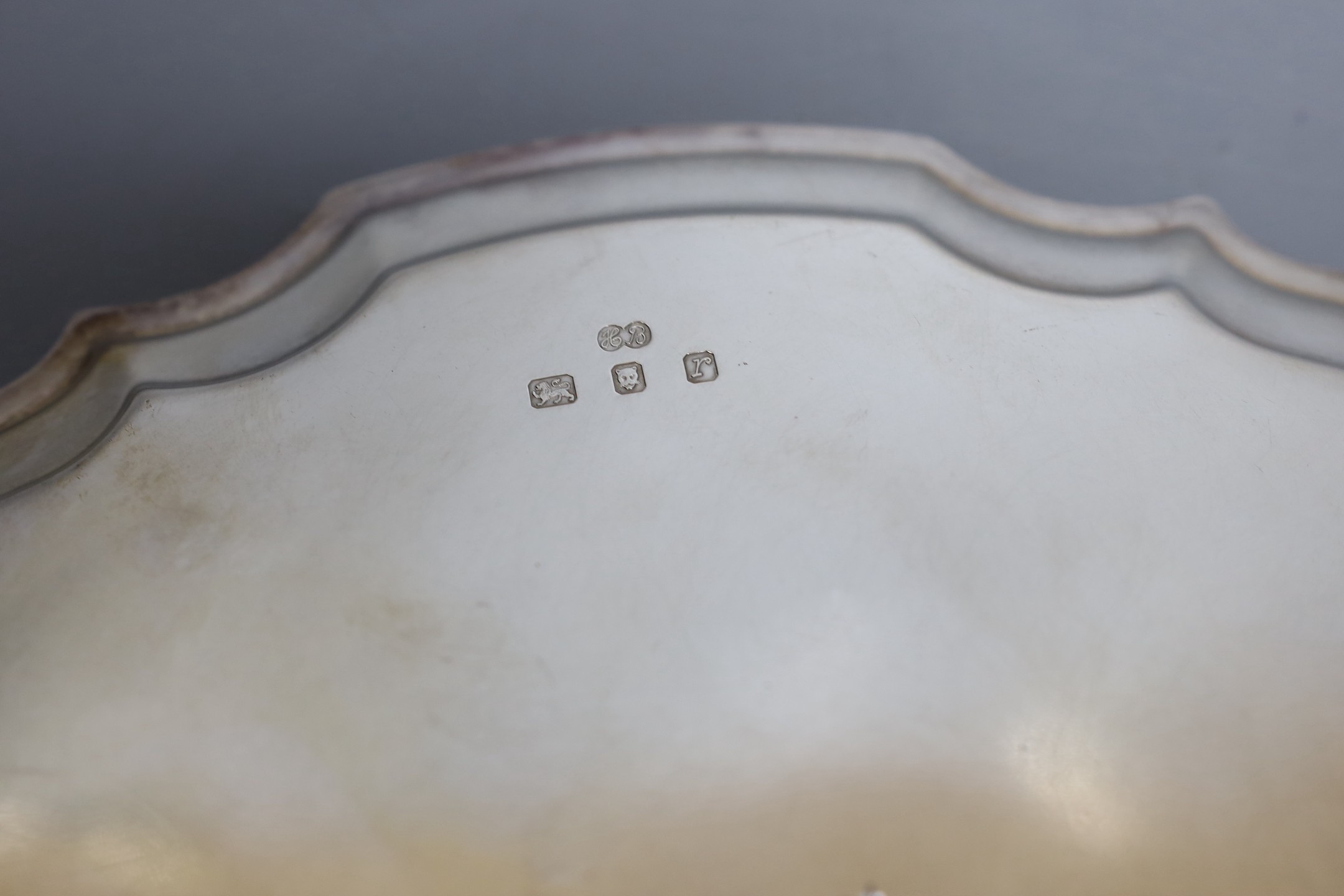 A modern silver salver with scroll feet and inscription verso, maker, HB, London, 1972, 25.3cm, 14.9oz.